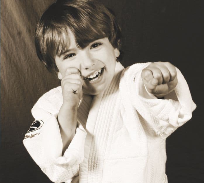 A young PMA Little Dragon in his white uniform